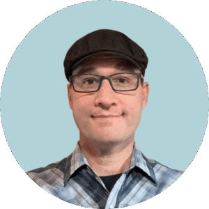 jake fatooh a professional portrait of a man wearing a hat and glasses